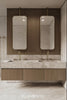 A beautiful bespoke double vanity with perfectly installed faucets.