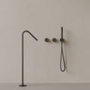 Modern Angled Floor Mounted Bathtub Filler with Dual Knob Control and Handheld