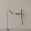 Modern Angled Floor Mounted Bathtub Filler with Dual Knob Control and Handheld
