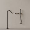 Modern Angled Floor Mounted Bathtub Filler with Dual Knob Control and Handheld